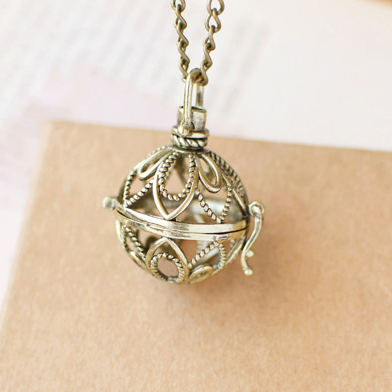 Retro Artistic Hollowed-out Sachet Ball Pendant Necklace