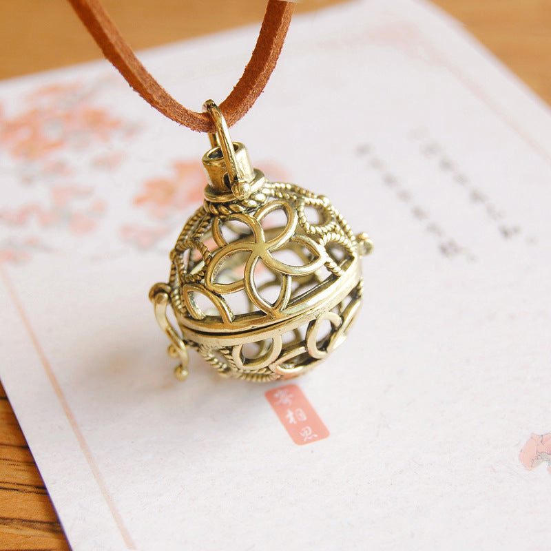 Retro Artistic Hollowed-out Sachet Ball Pendant Necklace